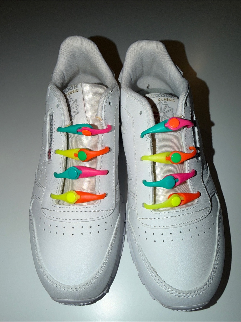 Reebok White Kids Sneakers with Pink, Teal, Yellow and Orange No-Tie Lace Clips